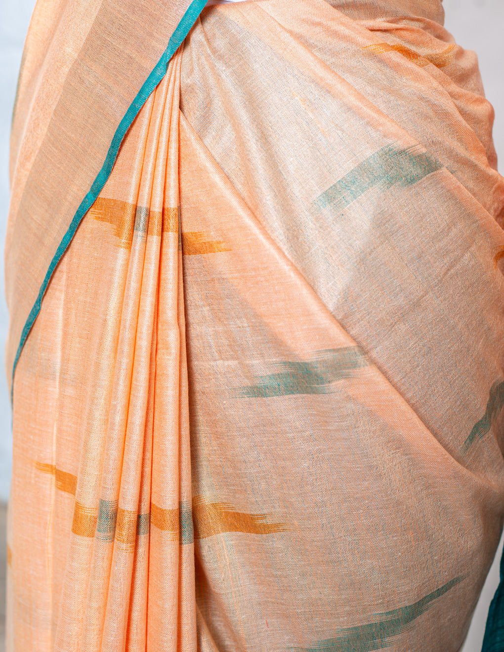 Peach & Green Ikkat Linen Handloom Saree